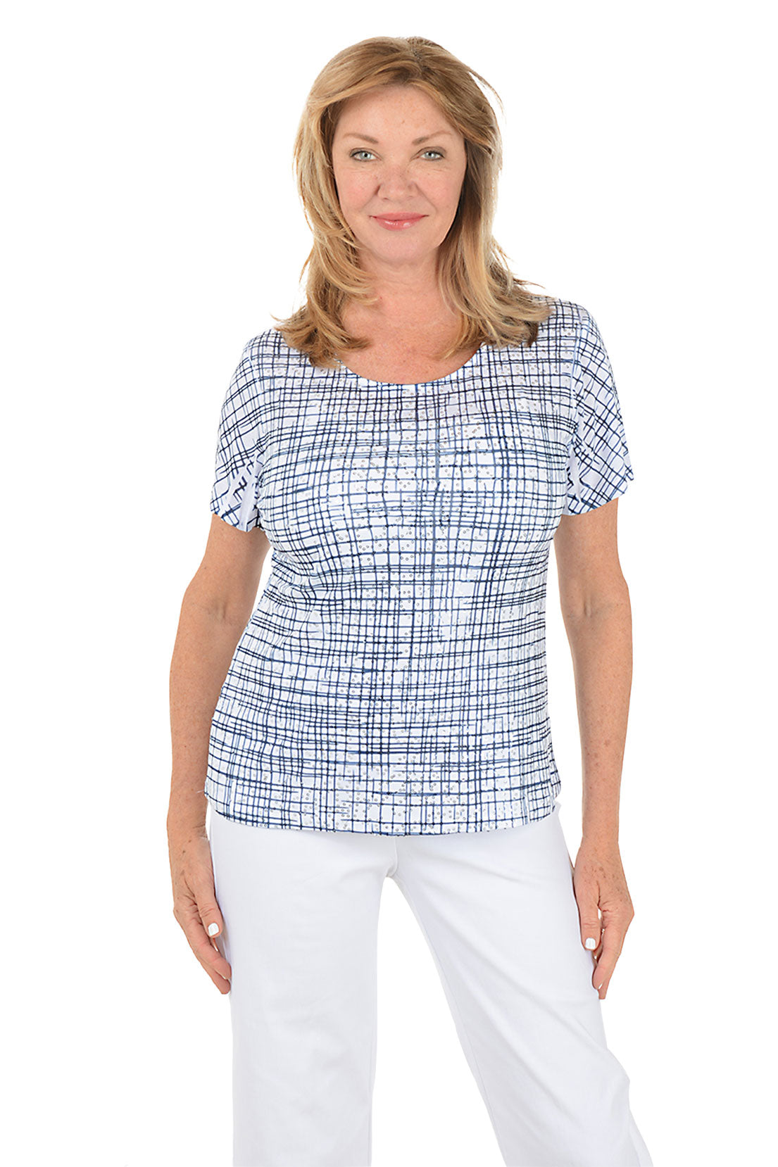 Woman wearing a blue checkered top and white pants on a white background.