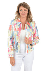 Woman wearing a colorful jacket over a white shirt and pants on a white background.