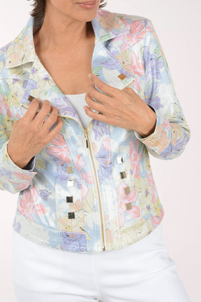 Woman wearing a pastel floral jacket on a white background