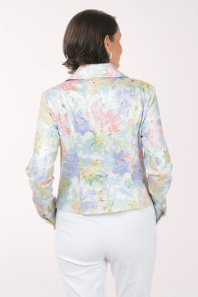 Woman wearing a pastel floral jacket on a white background
