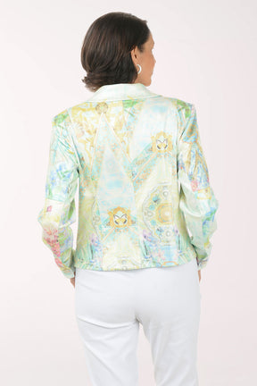 Woman wearing a colorful floral jacket on a white background