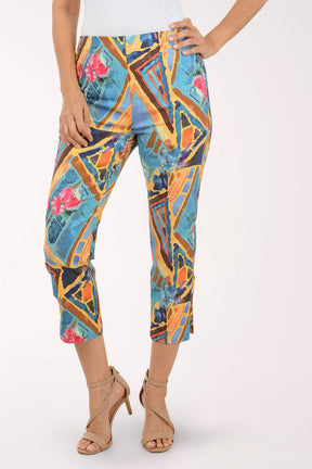 Colorful geometric-patterned pants worn by a person on a white background