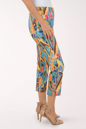 Colorful geometric-patterned pants worn by a person on a white background