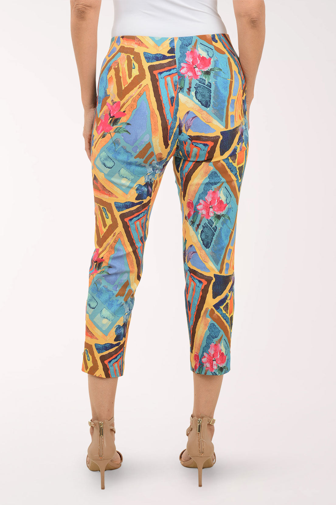 Colorful geometric-patterned pants worn by a person on a white background