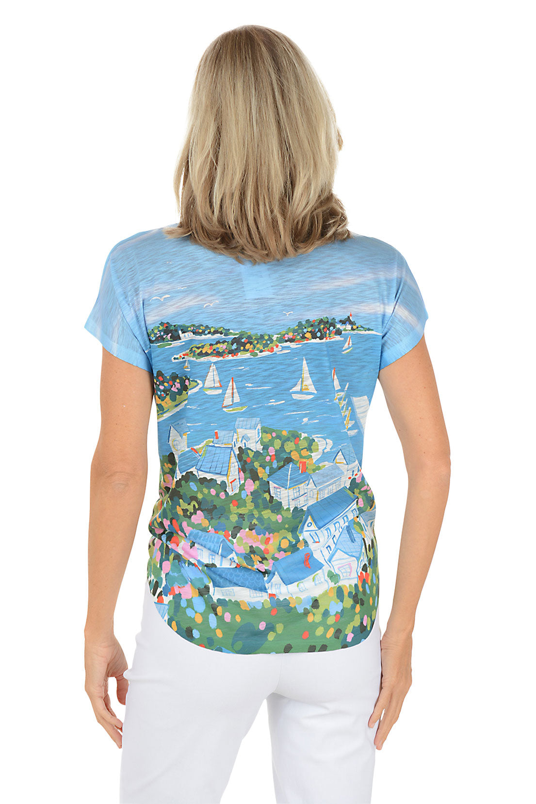 A woman wearing a blue short sleeve v-neck shirt with a sailboat design. Back shot.