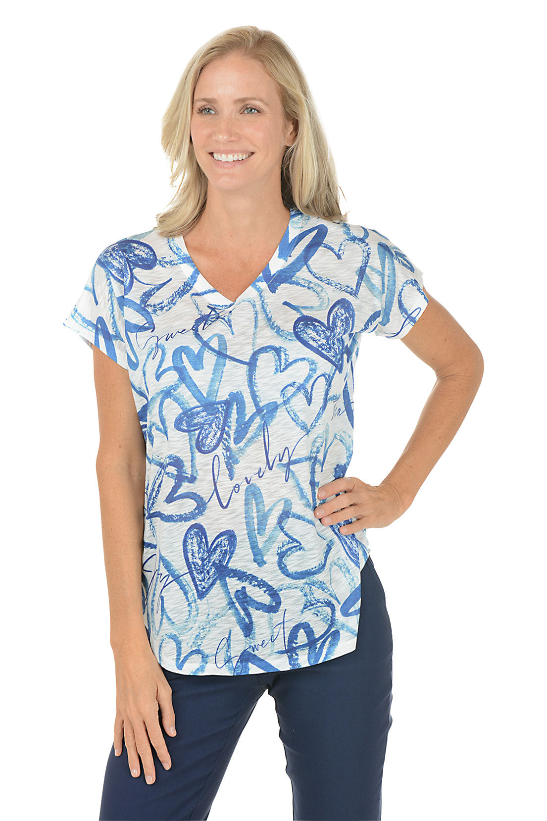 Woman wearing a blue and white patterned top on a white background.
