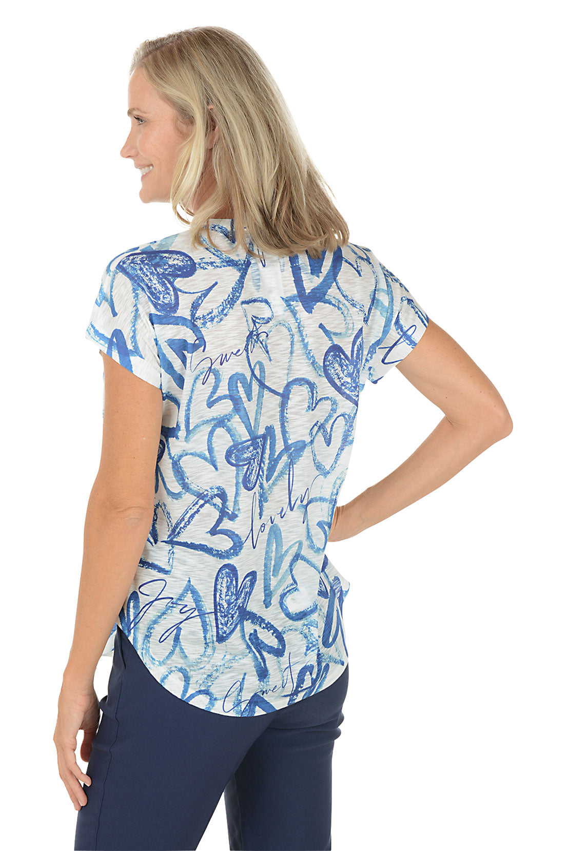Woman wearing a blue and white patterned top on a white background. Back shot.