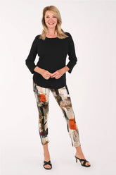 Woman wearing a black top abstract printed leggings