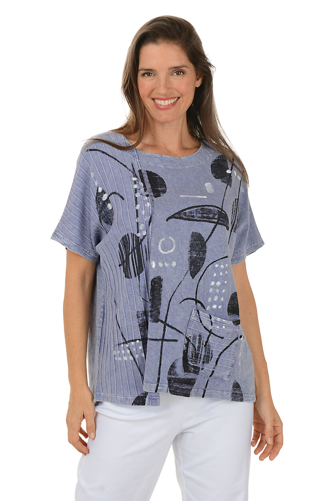 Woman wearing a blue abstract patterned top on a white background.