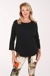 Woman wearing a black 3/4 sleeve top