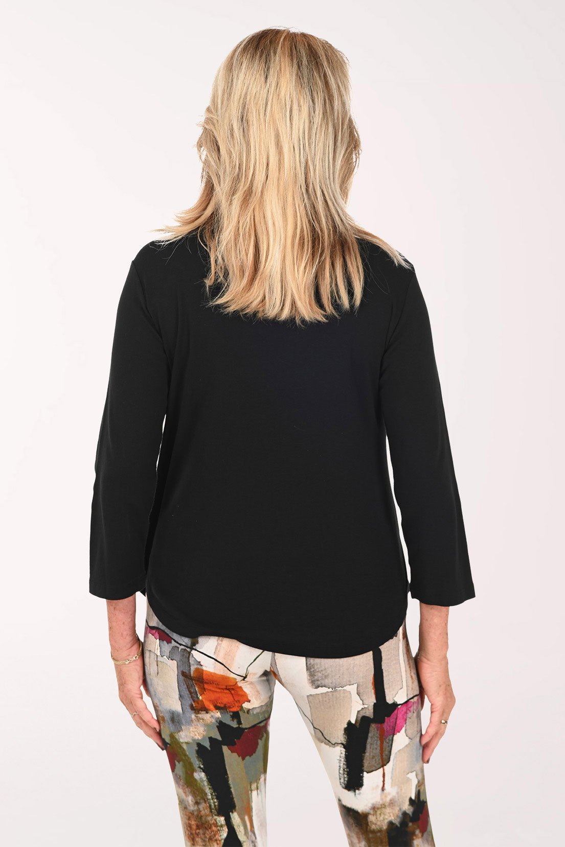 Woman wearing a black 3/4 sleeve top