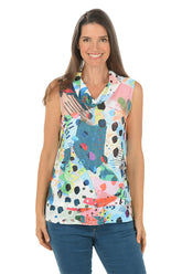 Woman wearing a colorful sleeveless top with abstract patterns on a white background.