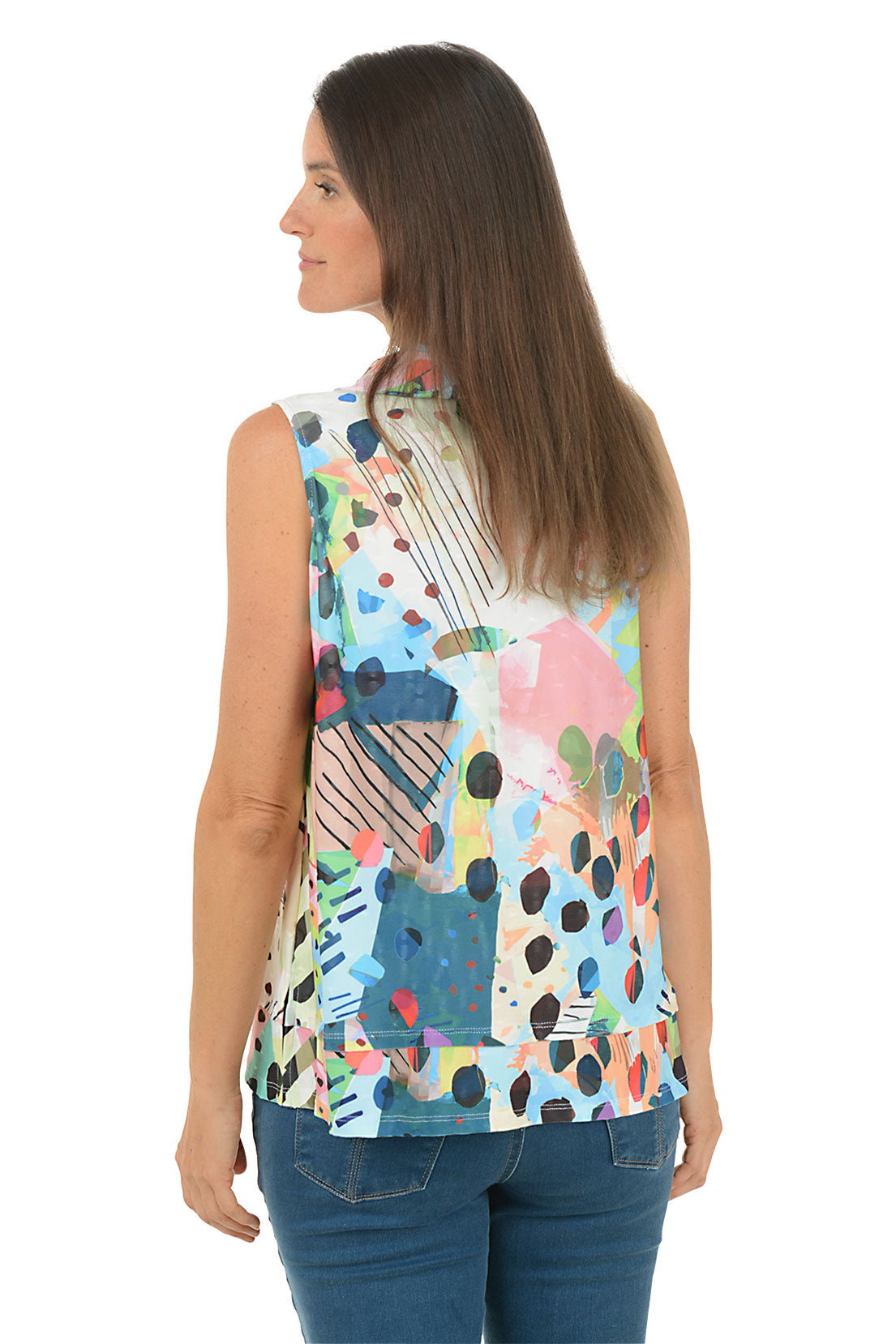 Woman wearing a colorful sleeveless top with abstract patterns on a white background. Back shot.