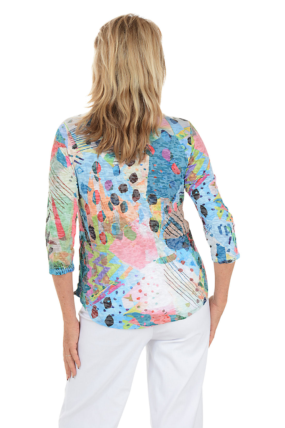 A woman wearing a multi-colored 3/4 sleeve top. Back shot.