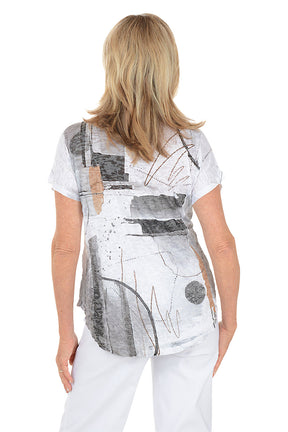 Woman wearing a white t-shirt with abstract black and gray design on a white background. Back shot.
