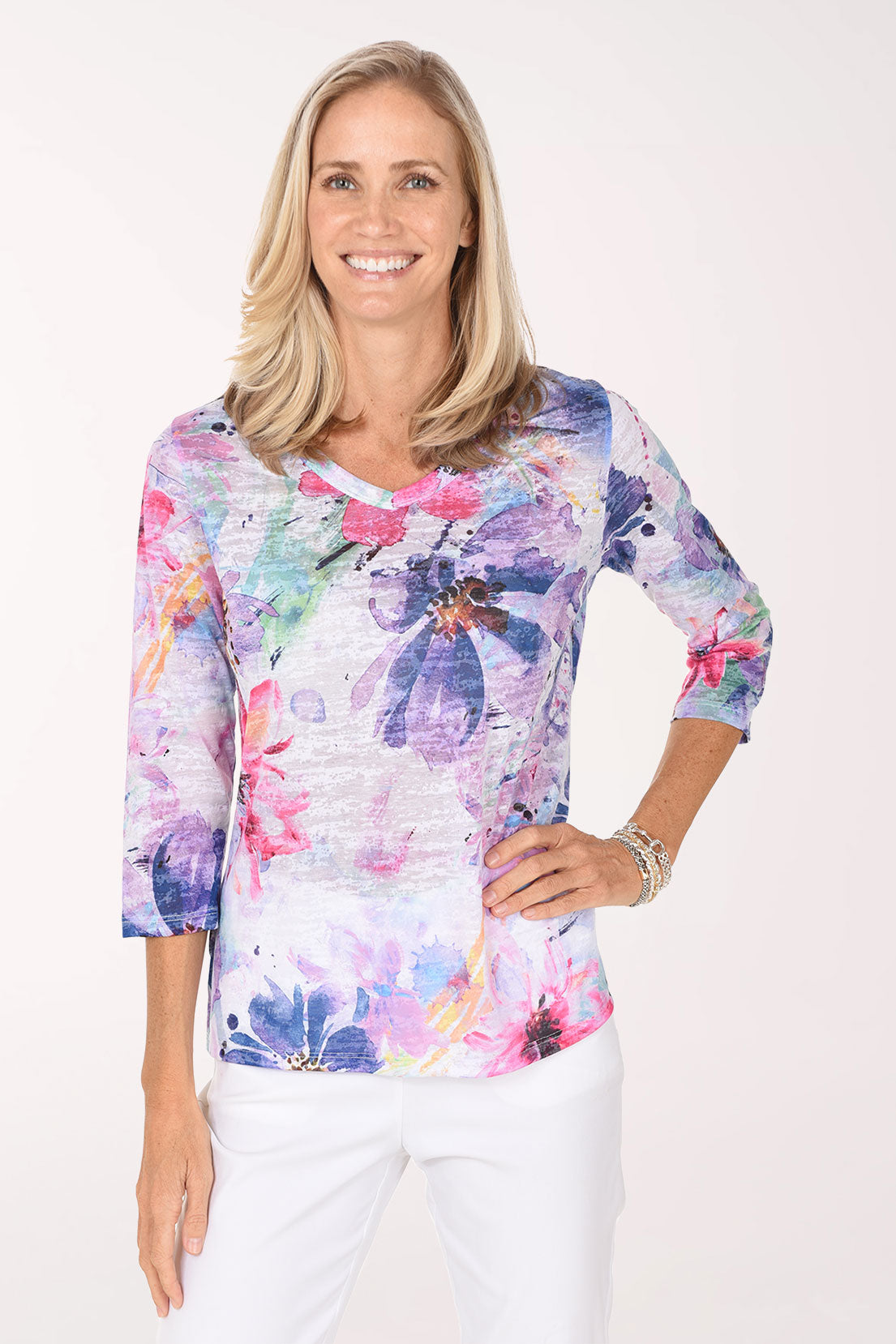 Model wearing the Jess and Jane Lady Burnout V-Neck Knit Top, lavender, violet, pink and blue watercolor blooms on white, front view