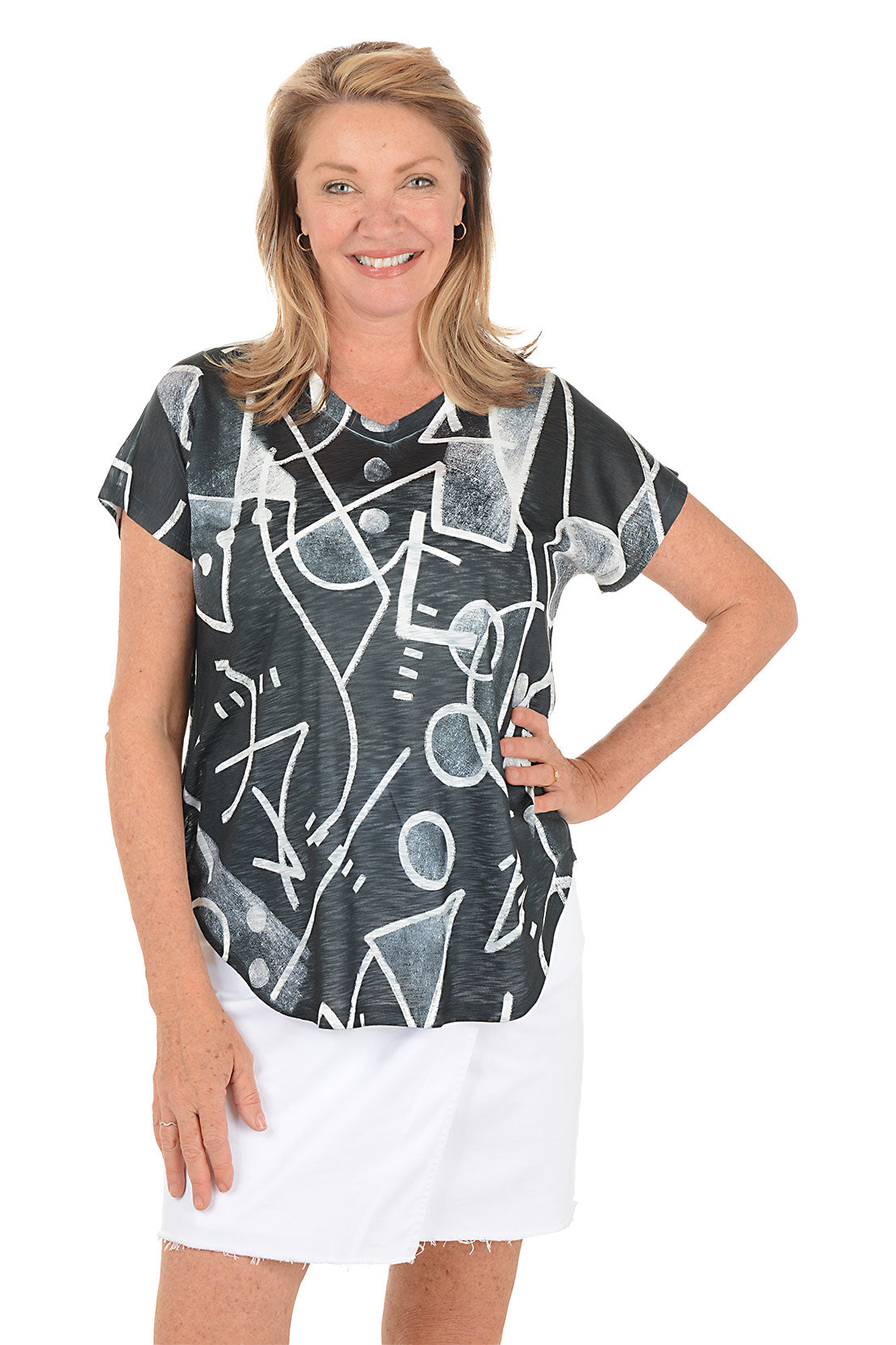 Woman wearing a black t-shirt with white abstract patterns on a white background.