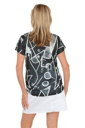 Woman wearing a black t-shirt with white abstract patterns on a white background. Back shot.