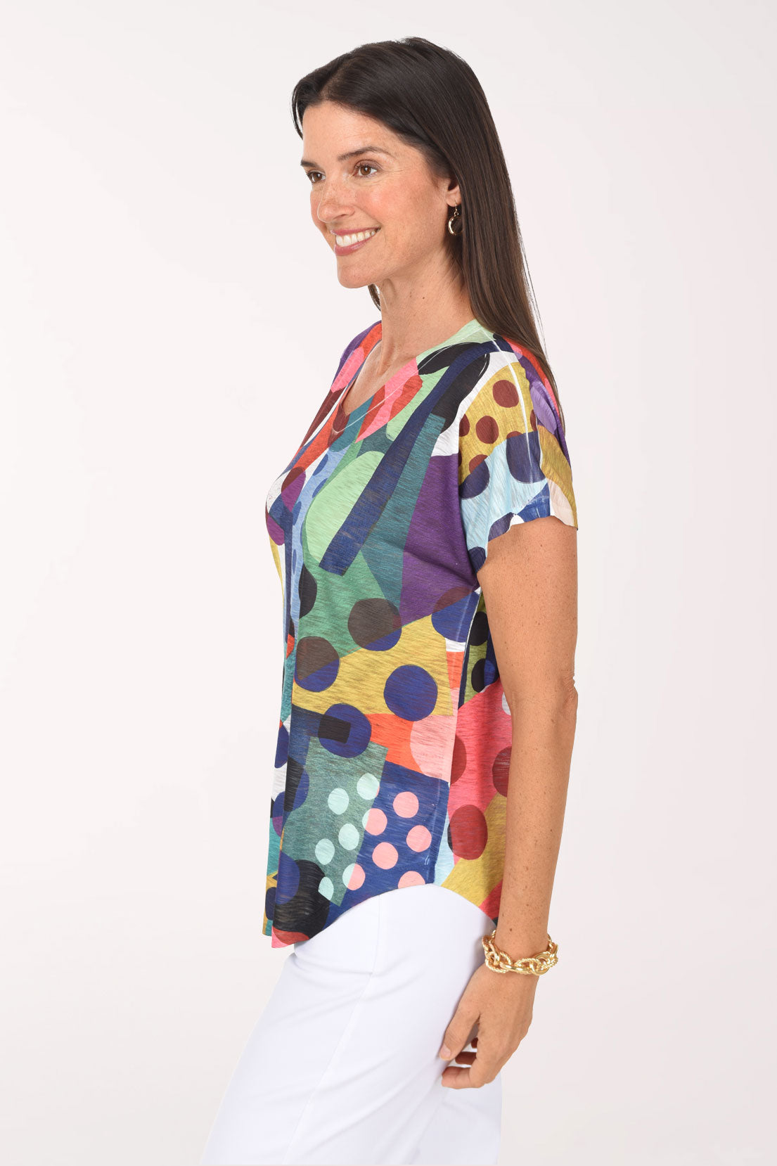 Side view of the Dot Day Slub Knit Short Sleeve Top showing the curved hem