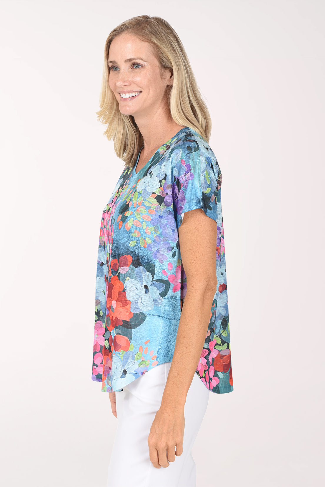 Side view of the Petunia Slub Knit Short Sleeve Top showing the dolman sleeve and curved hem