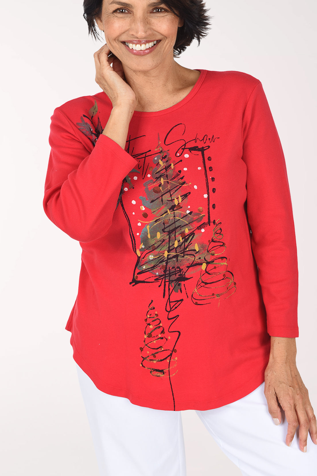 Close front view of the red cotton top, showing the sketched tree graphic and curved hem