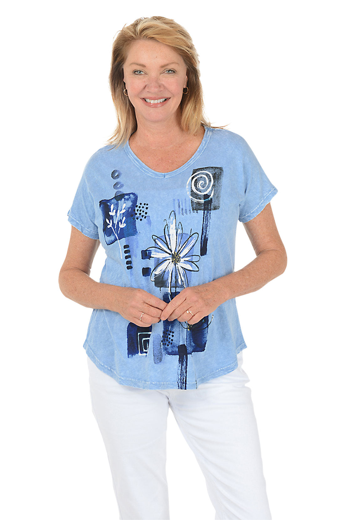 Woman wearing a blue floral graphic t-shirt against a white background.