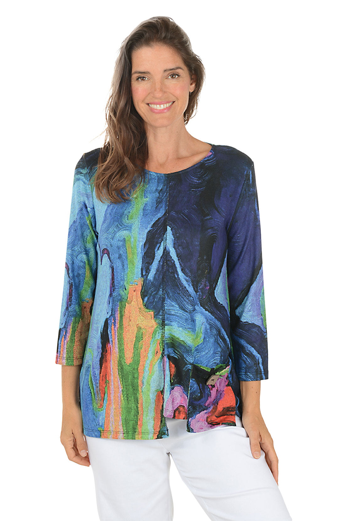 Woman wearing a colorful long-sleeve top with abstract design on a white background. Second front shot.