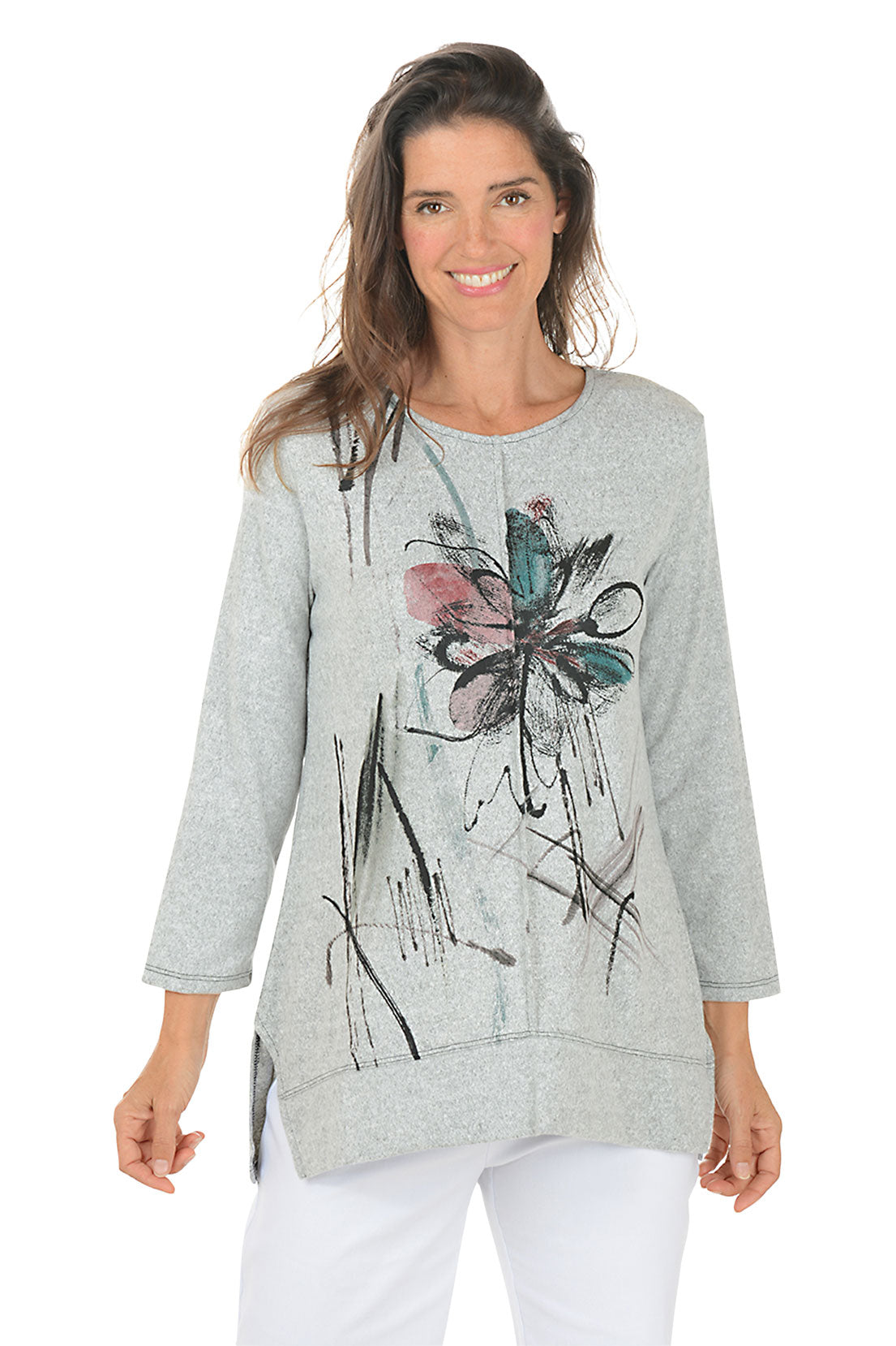 Woman wearing a gray sweater with a colorful butterfly design on a white background. 