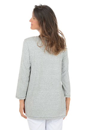Woman wearing a gray sweater with a colorful butterfly design on a white background.  Back shot.