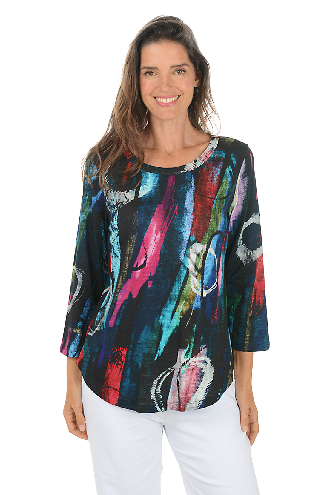 Woman wearing a colorful abstract patterned top on a white background.