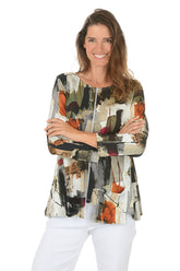 Woman wearing a colorful patterned jacket on a white background.