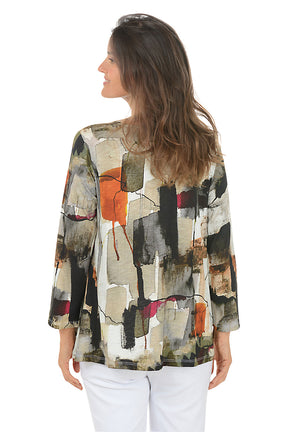 Woman wearing a colorful patterned jacket on a white background. Back shot.