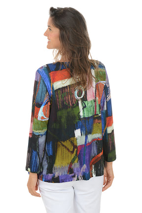 Woman wearing a colorful abstract-patterned blouse on a white background. Back shot.
