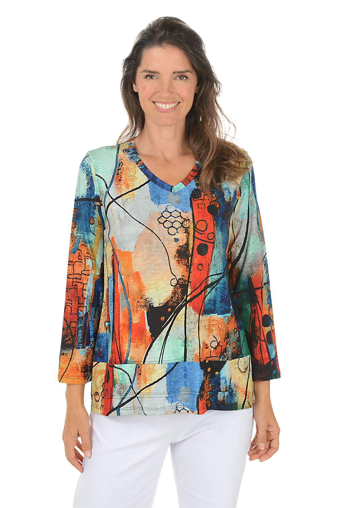 Woman wearing a colorful abstract patterned top on a white background.