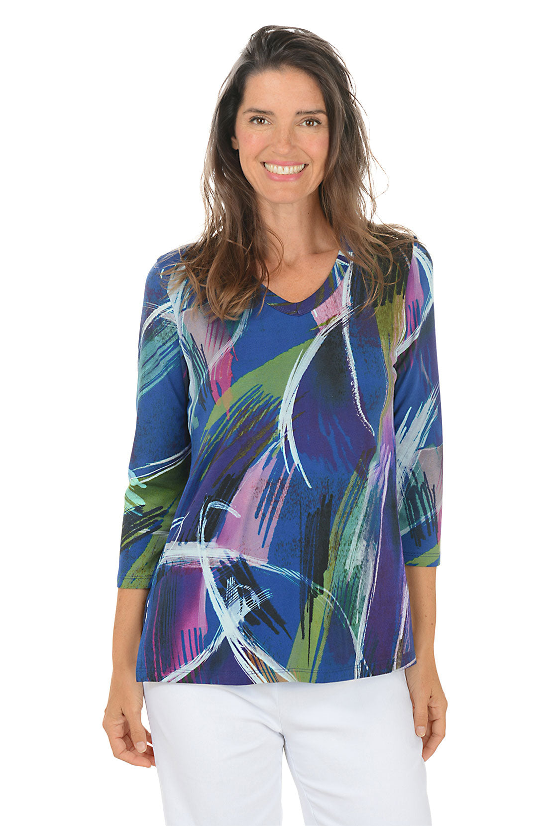 Woman wearing a colorful abstract patterned top on a white background.