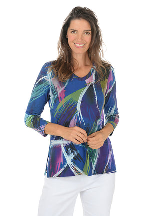 Woman wearing a colorful abstract patterned top on a white background. Second front shot.