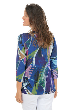 Woman wearing a colorful abstract patterned top on a white background. Back shot.