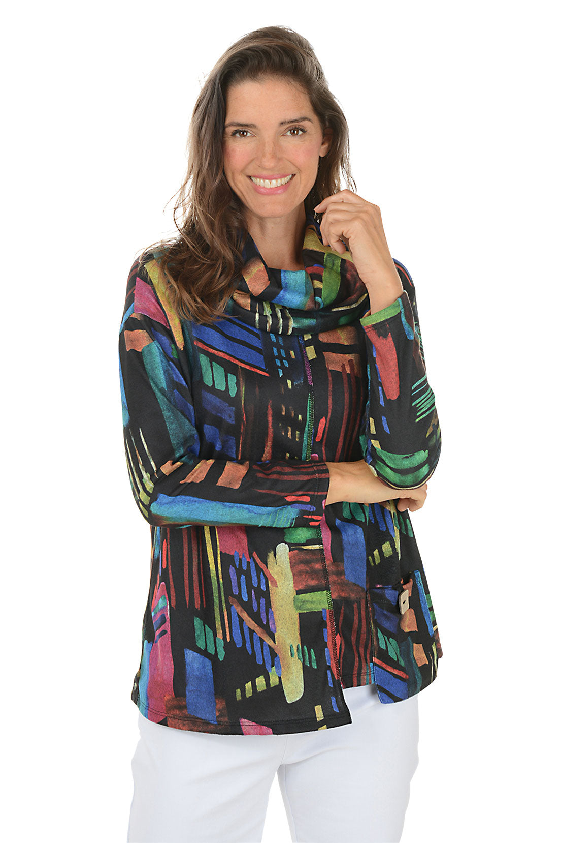 Woman wearing a colorful patterned top on a white background.