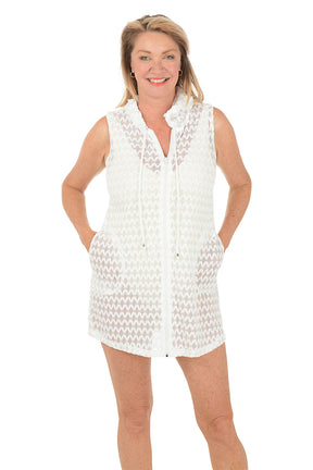 Woman wearing a white sleeveless dress on a white background. Second front shot.