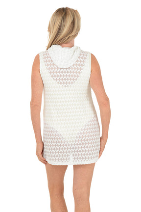 Woman wearing a white sleeveless dress on a white background. Back shot.