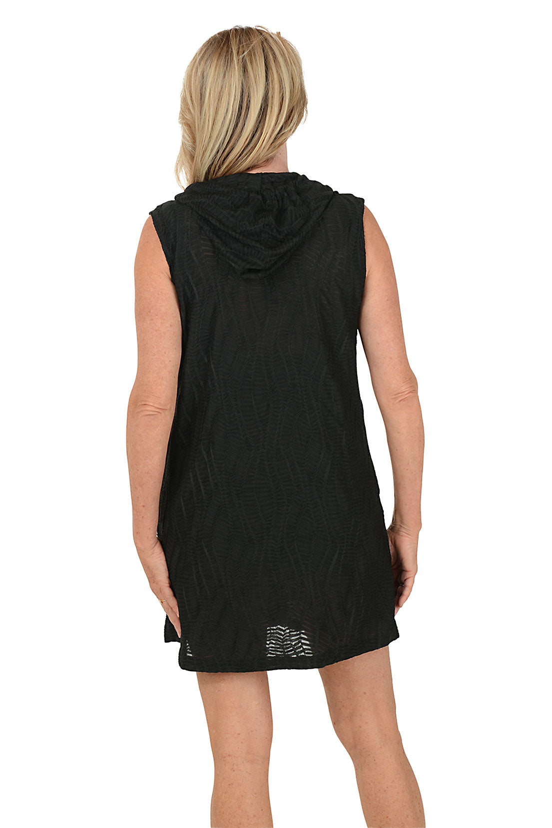 Woman wearing a black sleeveless dress with buttons on a white background. Back shot.