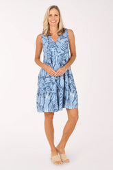 Woman wearing a blue sleeveless dress 