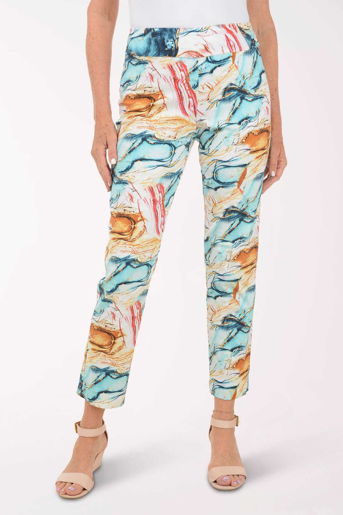 Multicolored abstract patterned pants worn by a person on a white background