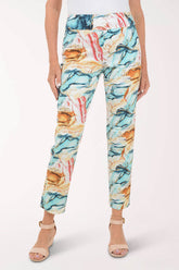 Multicolored abstract patterned pants worn by a person on a white background