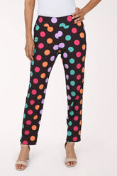 Women wearing black pull-on ankle pants with multicolored dots