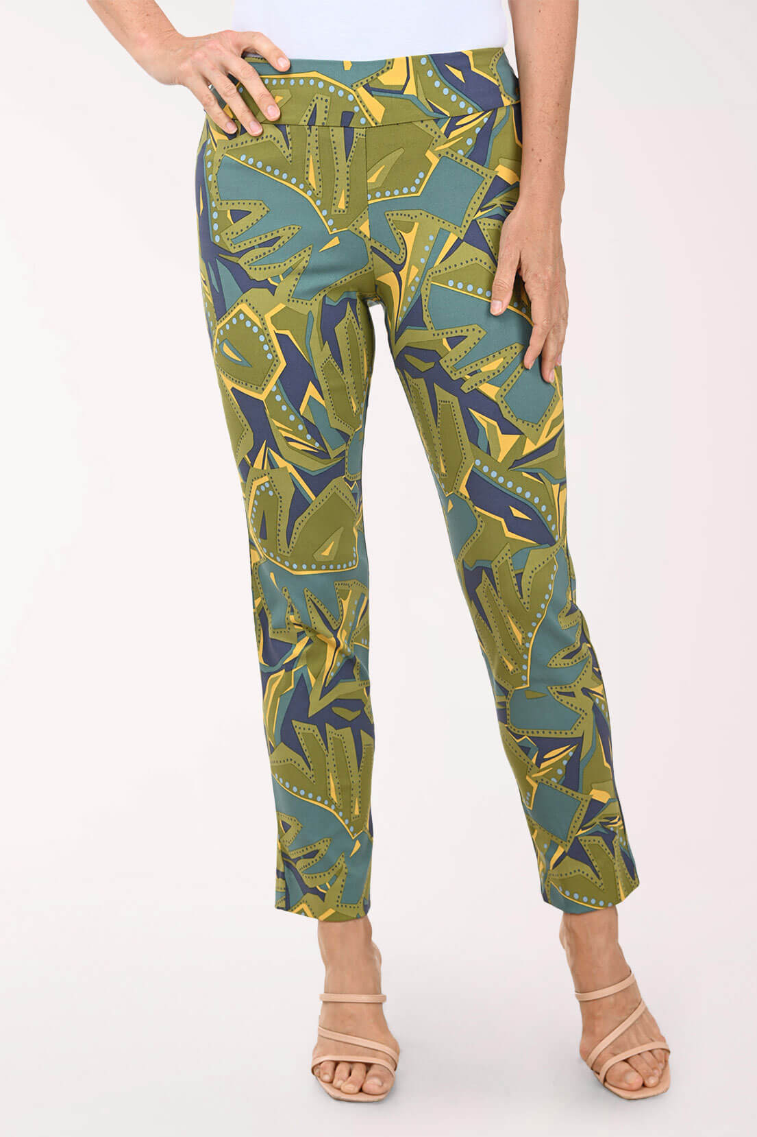 Green and blue patterned pants worn by a person on a white background