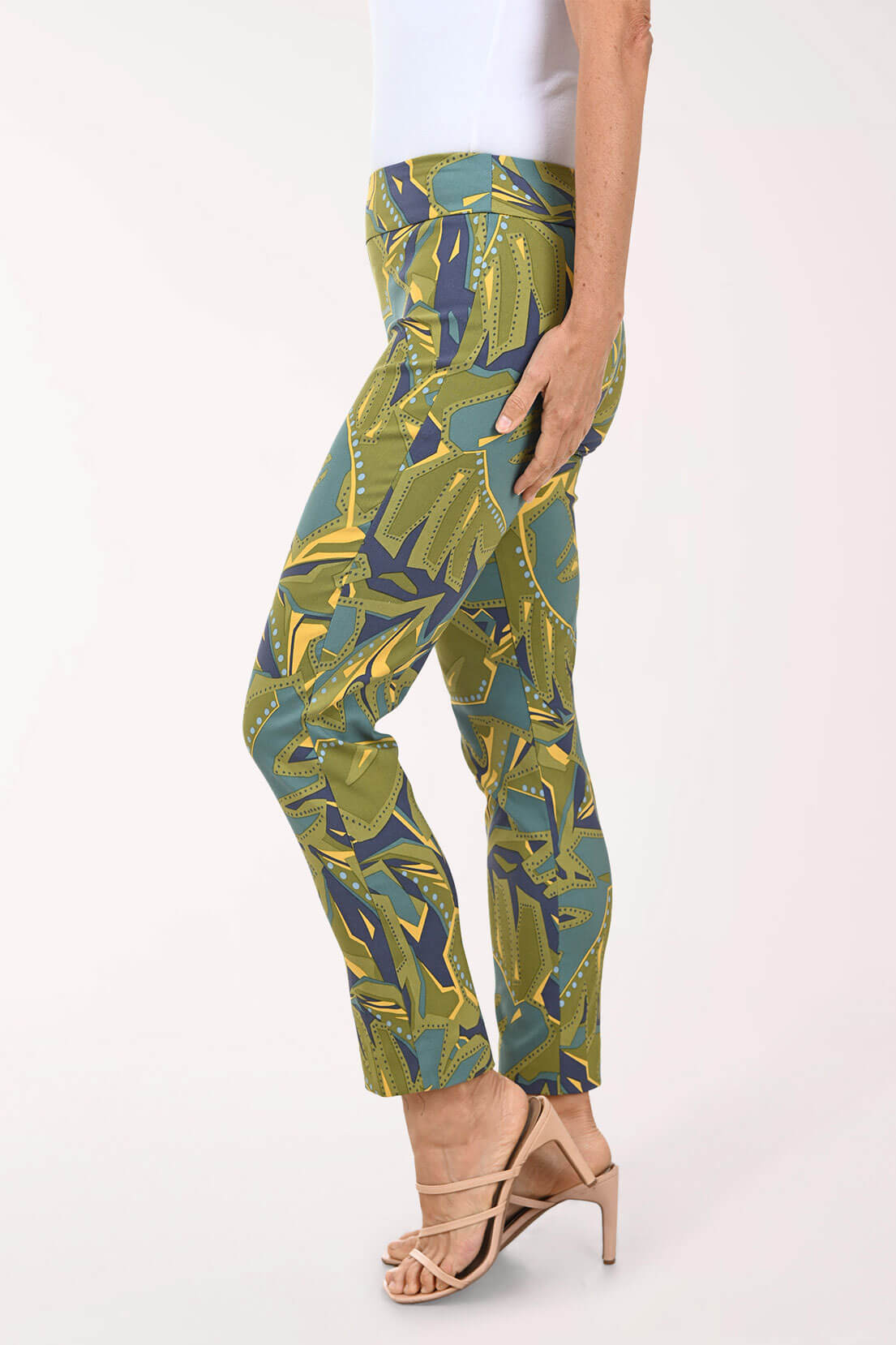 Green and blue patterned pants worn by a person on a white background