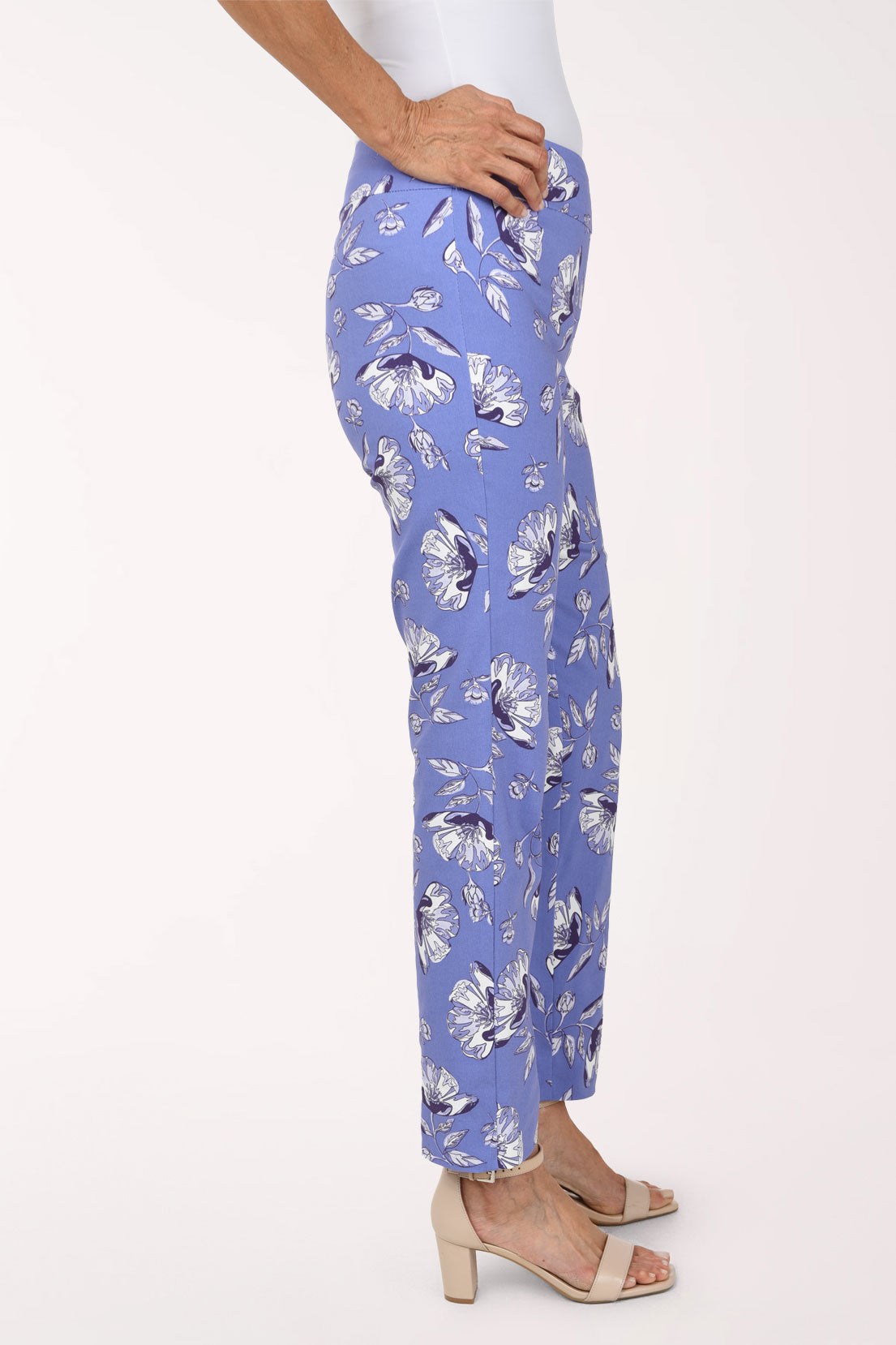 Women wearing a lilac blue pull-on ankle pant with white flowers