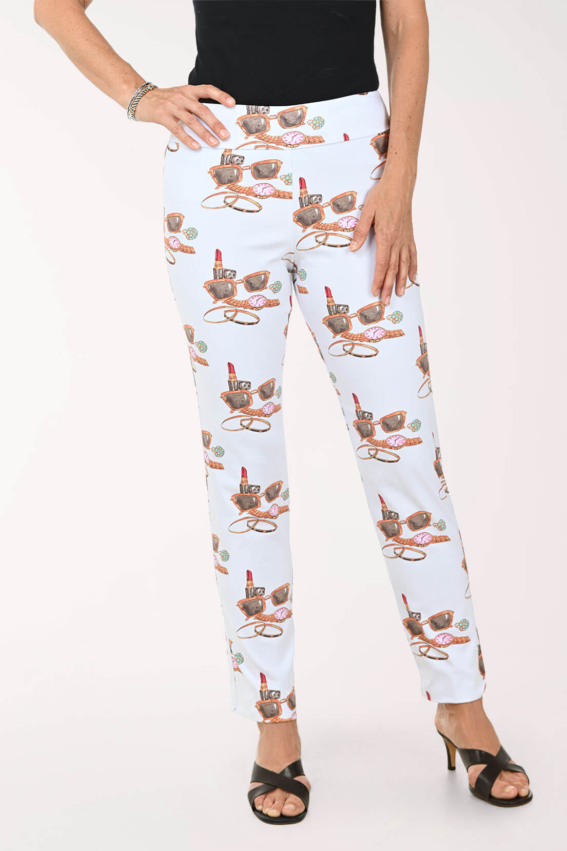 White pants with lipstick print worn by a person on a white background
