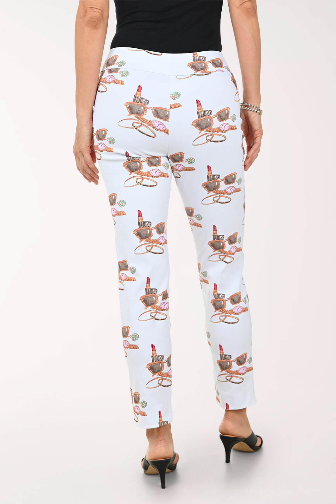 White pants with lipstick print worn by a person on a white background